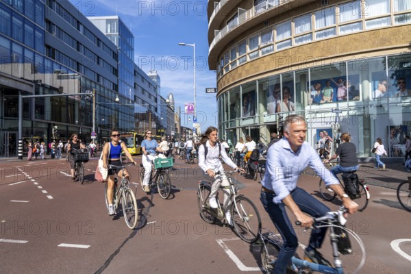 Central cycle path along the Vredenburg, in the city centre of Utrecht, lanes for pedestrians, cyclists and local traffic are separated, dense traffic, no car/truck traffic, Utrecht, Netherlands