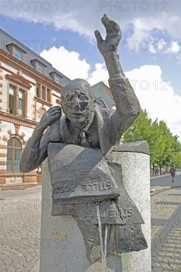 Postal fountain with sculpture symbolising silent mail, inscription, telephoning, gesture, arm, high, above, post office, Bernburg, Saxony-Anhalt, Germany