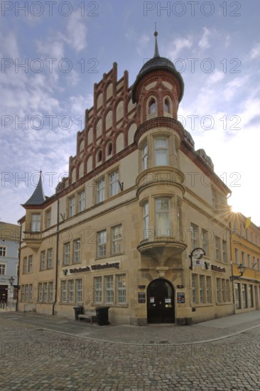 Historic building of the Volksbank with oriel and decorations, corner turret, Luther city Wittenberg, Fläming, Saxony-Anhalt, Germany