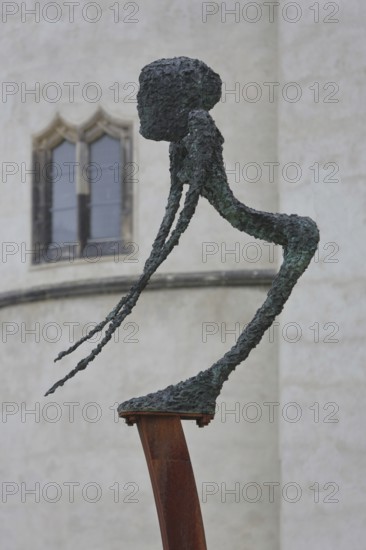 Sculpture Dying, Unbearable Lightness by Frank Seidel, modern art, bronze sculpture, dying, unbearable, painful, lightness, thin, slender, long, pointed, arms, body, castle park, castle meadow, Luther city Wittenberg, Fläming, Saxony-Anhalt, Germany