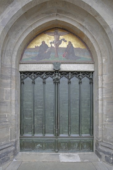 Thesis door and tympanum of the castle church with 95 theses published by Martin Luther on 30 October 1517, inscription, church door, mosaic, arts and crafts, Reformation, date, historical year, UNESCO, famous, castle church, castle, Luther city Wittenberg, Fläming, Saxony-Anhalt, Germany