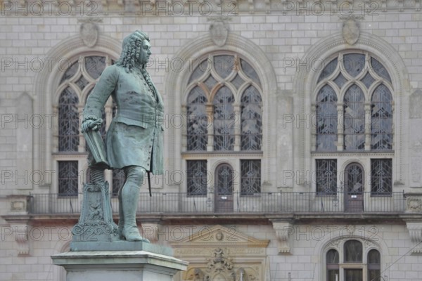 Sculpture Handel monument by Hermann Heidel 1859, George Frideric Handel, George with music stand, music stand and score, historical clothing, baroque, window of the neo-gothic town hall, Handel monument, market square, Halle an der Saale, Saxony-Anhalt, Germany