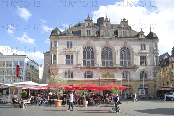Neo-Gothic town house and street pub, with people and pedestrians, pedestrian zone, market square, Halle an der Saale, Saxony-Anhalt, Germany