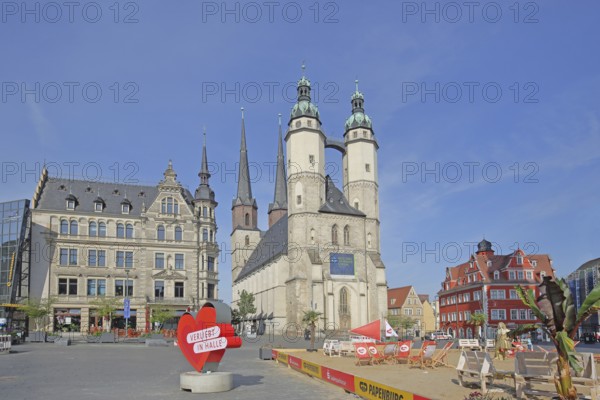 Market square with late gothic market church with twin towers, landmark, sandy beach, beach, people, pedestrian, sign, banner, inscription, in love, in love with, heart, heart-shaped, symbol, love, love, relationship, towers, Halle an der Saale, Saxony-Anhalt, Germany