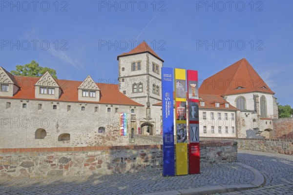 Moritzburg castle built in 1484 and entrance with banner to the art museum, Halle an der Saale, Saxony-Anhalt, Germany