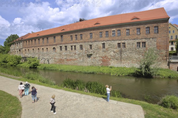 New Residence built in 1531 with bank of the millrace, pedestrian, photograph, Renaissance, Halle an der Saale, Saxony-Anhalt, Germany
