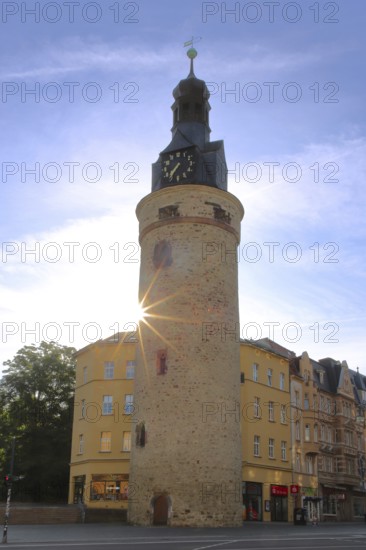 Historic Leipzig Tower built in the 15th century in backlight, sunbeams, former watchtower and part of the city fortifications, city tower, Halle an der Saale, Saxony-Anhalt, Germany