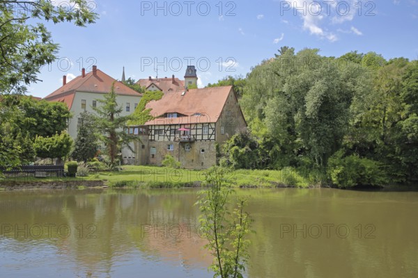 Saale river and historic half-timbered house Neumarktmühle, Saale valley, Merseburg, Saxony-Anhalt, Germany