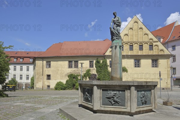 Four Seasons Fountain by Martin Wetzel 1981 and Domapotheke zum Rautenkranz, bronze sculpture, female figure with robe, robe fountain, Merseburg, Saxony-Anhalt, Germany