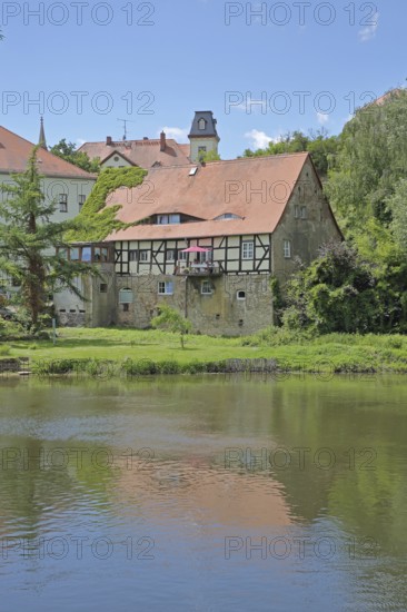 Saale river and historic half-timbered house Neumarktmühle, Saale valley, Merseburg, Saxony-Anhalt, Germany