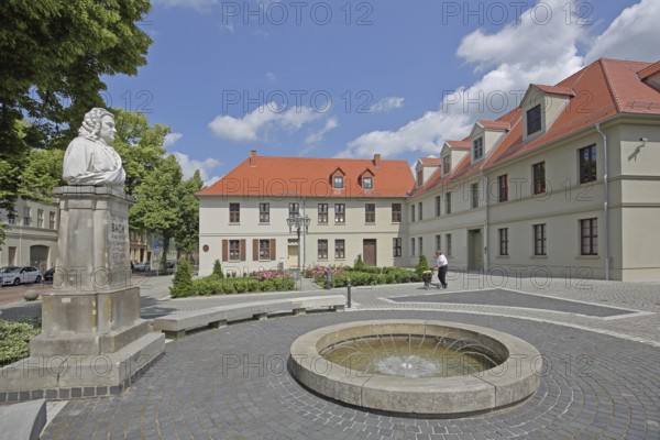 Bach monument, bust, Johann Sebastian Bach, sculpture, monument, fountains and houses, Bachplatz, Köthen, Saxony-Anhalt, Germany