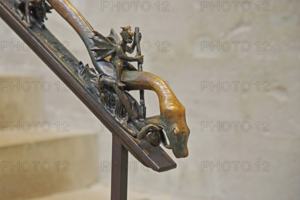 Handrail with sculpture and decorations, devil with wings riding on a snake, snake figure, snake head, sitting, railing, interior view, detail, UNESCO, Cathedral, St Peter and Paul, Cathedral, Saale, Naumburg, Romanesque Road, Saxony-Anhalt, Germany