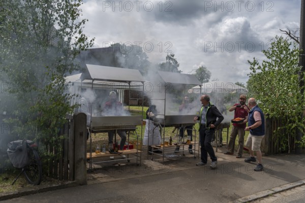 Heavy smoke at the sausage grill stations at the Backofenfest, Kleingeschaidt, Middle Franconia, Bavaria, Germany