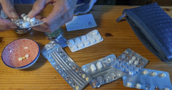 Daily compilation of medication at the dining table, Basyern, Germany
