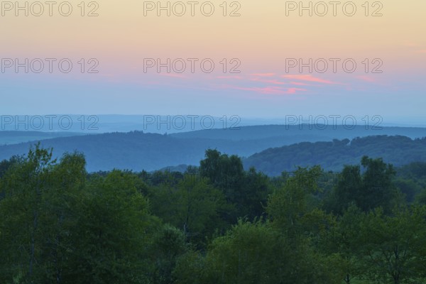 Pink evening sky over a gentle hilly landscape, peaceful nature, Geishöhe, Dammbach, Spessart, Bavaria, Germany