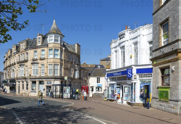 Street and shops including WH Smith in town centre of Teignmouth, south Devon, England, UK