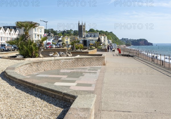 Seafront promenade view east towards St Michael's church, Teignmouth, south Devon, England, UK