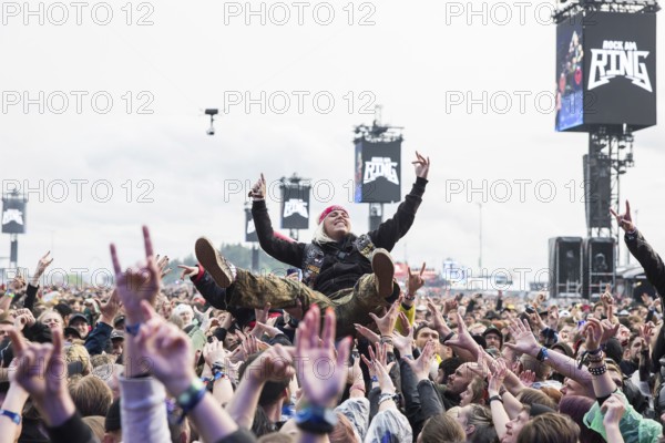 Festival visitor crowdsurfing at the Rock am Ring Festival on Friday, Nürburgring race track race track, 07.06.2025