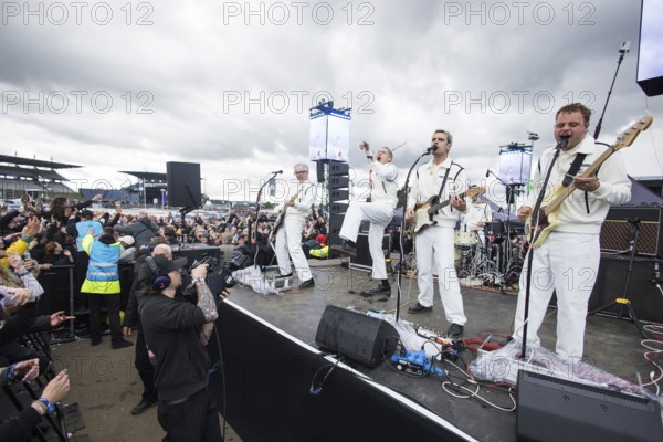 Steffen Israel (guitarist and keyboarder), Felix Brummer (singer), Karl Schumann (guitarist) and Till Brummer (bassist) of Kraftklub at a secret gig of the band at the Rock am Ring Festival on Saturday, Nürburgring race track race track, 07.06.2025