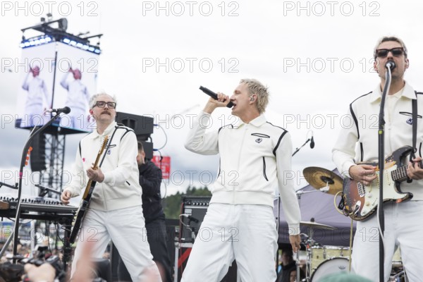 Steffen Israel (guitarist and keyboarder), Felix Brummer (singer) and Karl Schumann (guitarist) of Kraftklub at a secret gig of the band at the Rock am Ring Festival on Saturday, Nürburgring race track race track, 07/06/2025