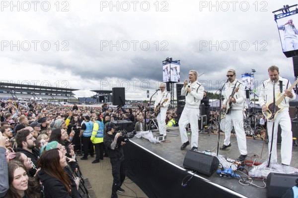 Steffen Israel (guitarist and keyboarder), Felix Brummer (singer), Karl Schumann (guitarist) and Till Brummer (bassist) of Kraftklub at a secret gig of the band at the Rock am Ring Festival on Saturday, Nürburgring race track race track, 07.06.2025
