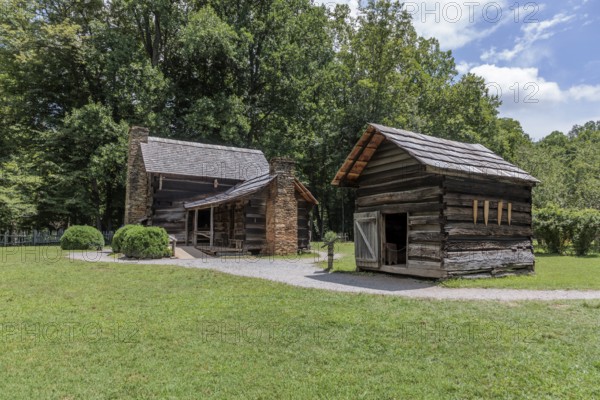 Historic log buildings at the Oconaluftee Visitor Center at Great Smoky Mountains National Park near Cherokee, North Carolina, USA