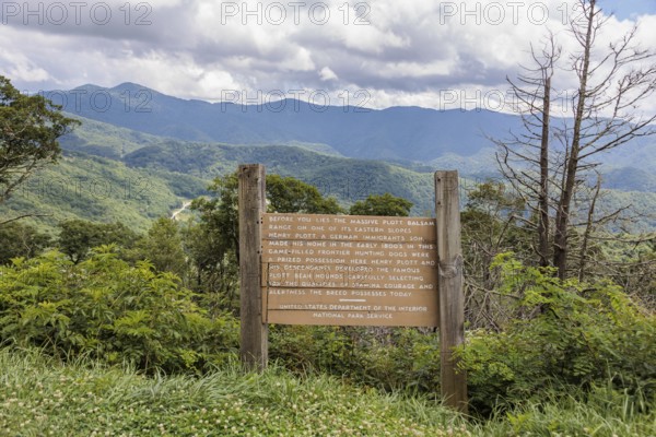 Sign along the Blue Ridge Parkway tells the origin of the Plott Bear Hounds in the Plott Balsam Range within the Smoky Mountains near Cherokee, North Carolina, USA