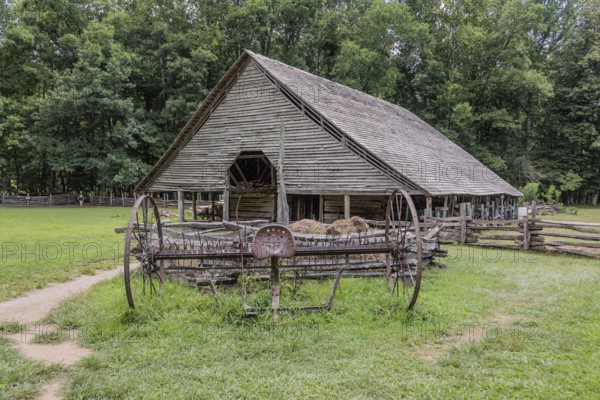 Historic log buildings at the Oconaluftee Visitor Center at Great Smoky Mountains National Park near Cherokee, North Carolina, USA