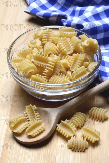 Italian pasta in a glass bowl, Radiatori variety
