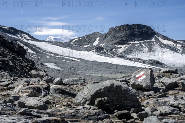 Path in rocky high mountain landscape with glacier, near the Col de Prafleuri, Valais, Western Alps, Switzerland