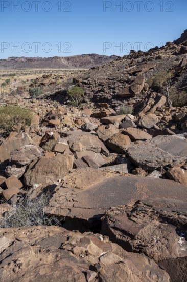Barren landscape with red rocks, in a valley, Twyfelfontein, Kunene, Namibia