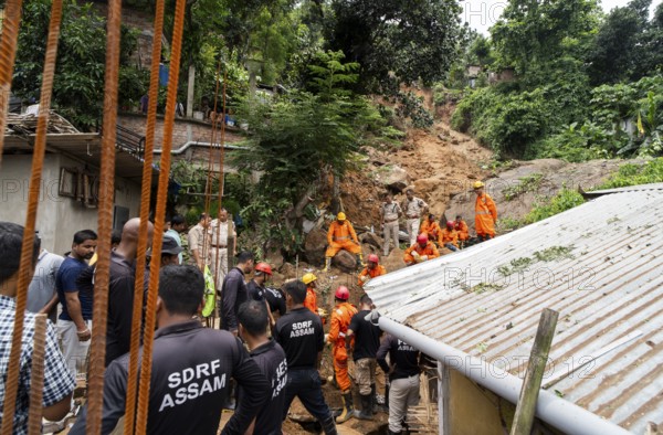 Rescue operations by the National Disaster Response Force (NDRF) and police are in full swing after a major landslide, triggered by a heavy downpour, in Guwahati, India, on June 7, 2025. One person was reported missing in thr landslide and two houses damaged
