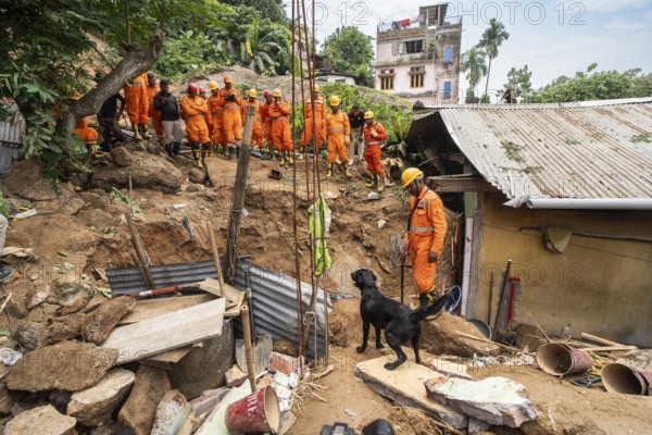 Rescue operations by the National Disaster Response Force (NDRF) and police, aided by sniffer dogs, are in full swing in search of a suspected dead body after a major landslide, triggered by a heavy downpour in Guwahati, India, on June 7, 2025. One person was reported missing in thr landslide and two houses damaged