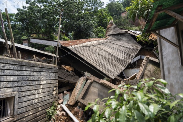 A damaged house after a major landslide, triggered by a heavy downpour, in Guwahati, India, on June 7, 2025. One person was reported missing in thr landslide and two houses damaged