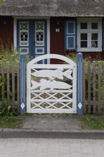 Decorated garden gate with carved fish, Wieck, Mecklenburg-Vorpommern, Germany