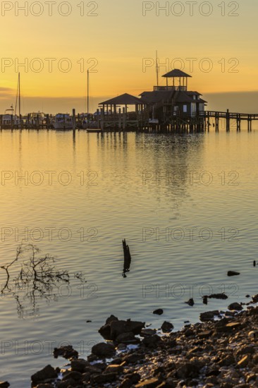 Biloxi Schooner Pier Complex at sunset on the Gulf of Mexico at Biloxi, Mississippi, USA