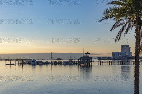Biloxi Schooner Pier Complex at sunset on the Gulf of Mexico at Biloxi, Mississippi, USA