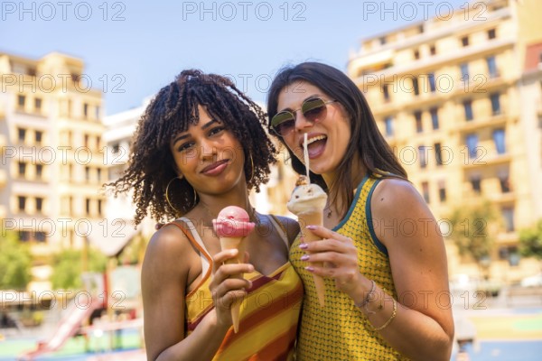 Two friends enjoying refreshing ice cream cones on a sunny day, sharing laughter and smiles in the vibrant city park atmosphere