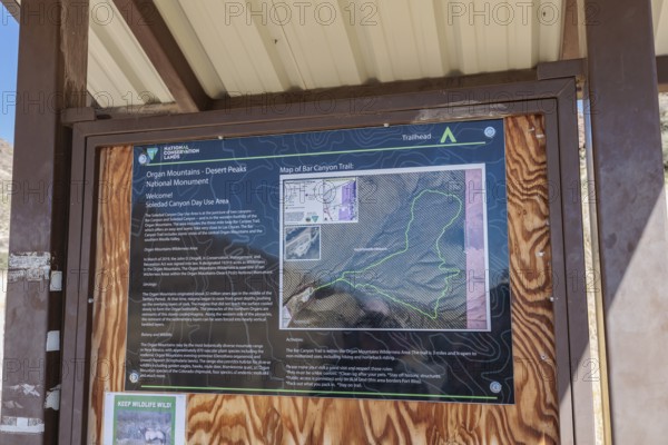 Sign at trailhead provides information for the Bar Canyon Trail in Organ Mountains - Desert Peaks National Monument in New Mexico, USA