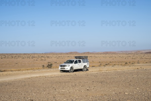 Off-road car on a sandy track, Brandberg, Damaraland, Namibia