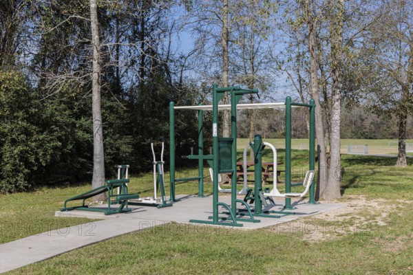 Outdoor fitness equipment in Cypress Creek Park at Timber Lane in Spring, Texas, USA