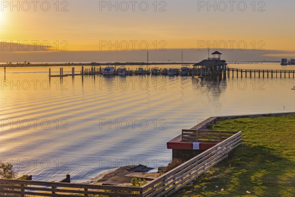 Biloxi Schooner Pier Complex at sunset on the Gulf of Mexico at Biloxi, Mississippi, USA