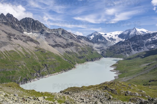 Blue mountain lake in a mountain landscape with glaciers, Lac des Dix reservoir and Mont Blanc de Cheilon peak, Valais Alps, Valais, Switzerland