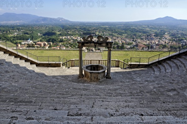 Fountain, draw well and flight of steps, rows of seats, auditorium, theatre of Roman antiquity at the baroque palace Palazzo Colonna Barberini, Palestrina, Campagna Romana, metropolitan city of Rome, Lazio, Italy