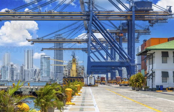 Busy international industrial port with freight and shipment docks and cargo containers