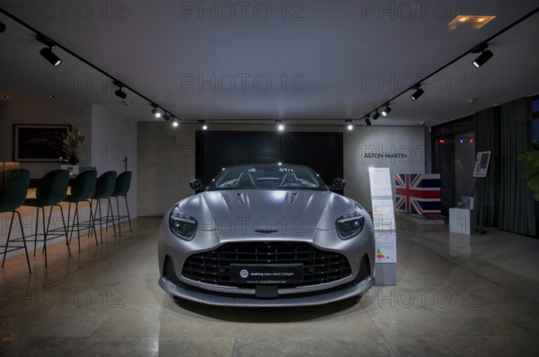 View through shop window to showroom, interior shot, sales exhibition of the car brand Aston Martin, DB12 Volante, Emil Frey, Stuttgart, Baden-Württemberg, Germany