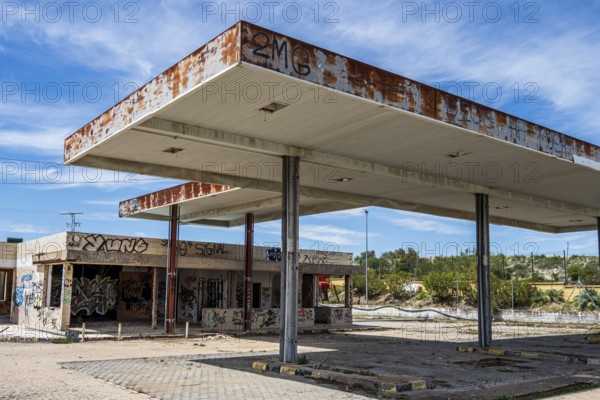 Ruins of a former gas station, now lost place, along road Ubeda-Baeza, Andalusia, Spain