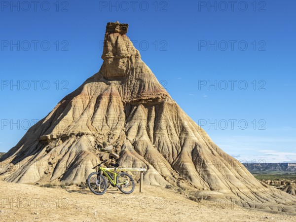 Castildetierra rock formation, single bicycle, semi-desert, Bardena Blanca area, Bardenas Reales Nature Park, Navarre, Spain