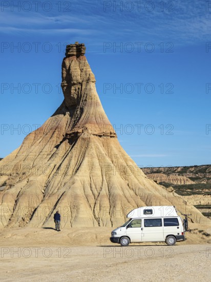 Camper van in front of Castildetierra rock formation, tourist, semi-desert, Bardena Blanca area, Bardenas Reales Nature Park, Navarre, Spain