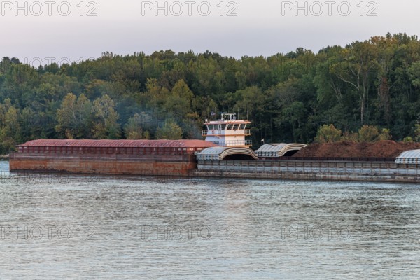 Tug boat pushing multiple barges on the Tennessee River near Savannah, Tennessee